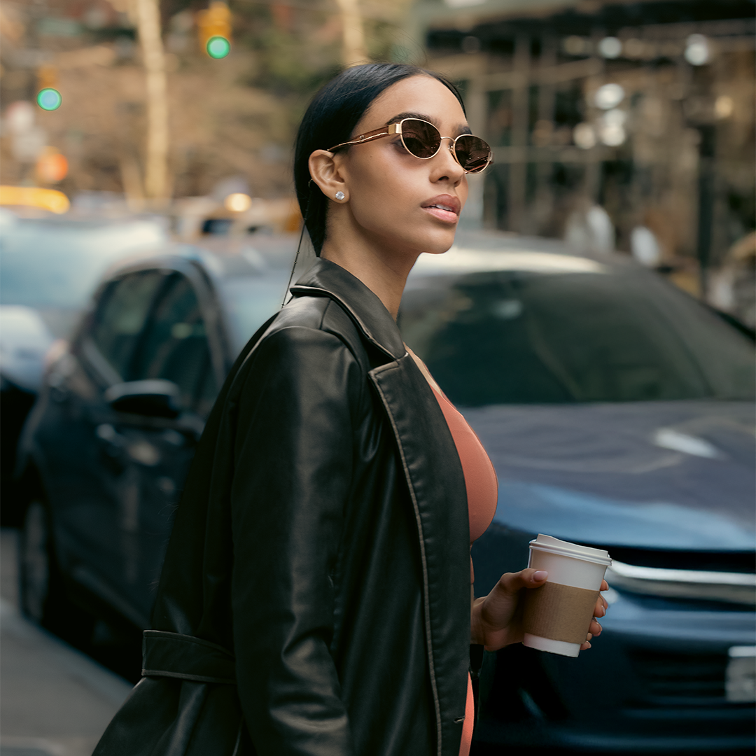 wearing sunglasses and a black jacket