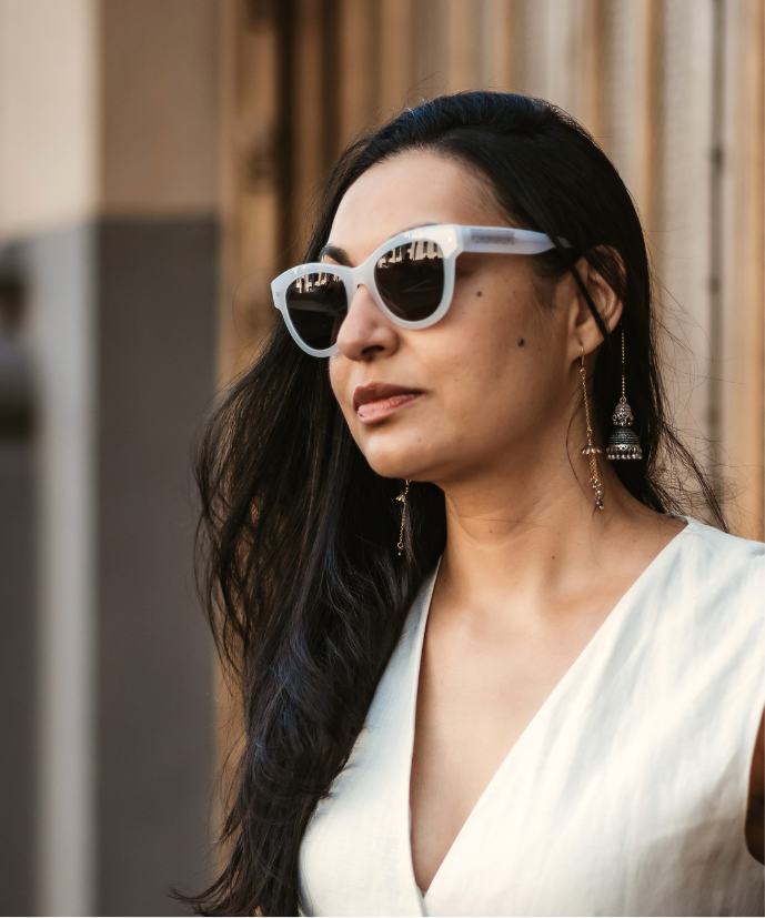 Woman wearing white sunglasses