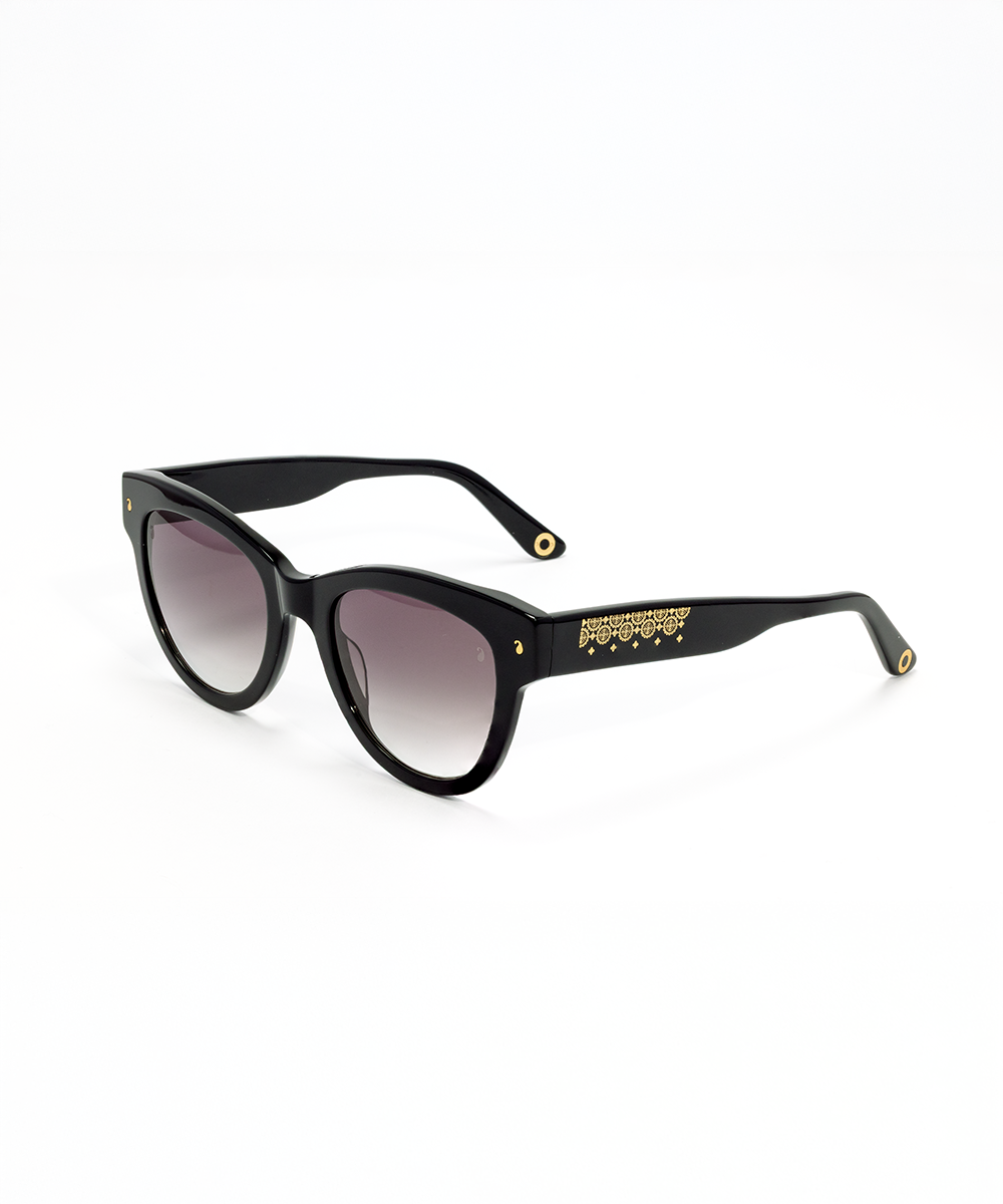 Black acetate sunglasses with metal foil design on the arms and a cat-eye shape.