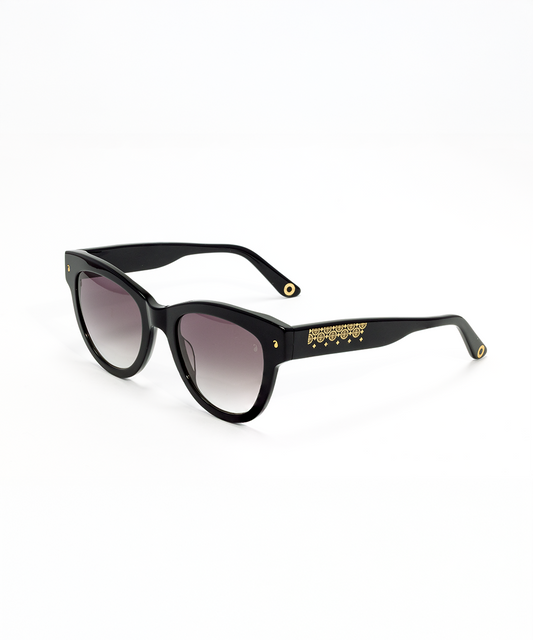 Black acetate sunglasses with metal foil design on the arms and a cat-eye shape.