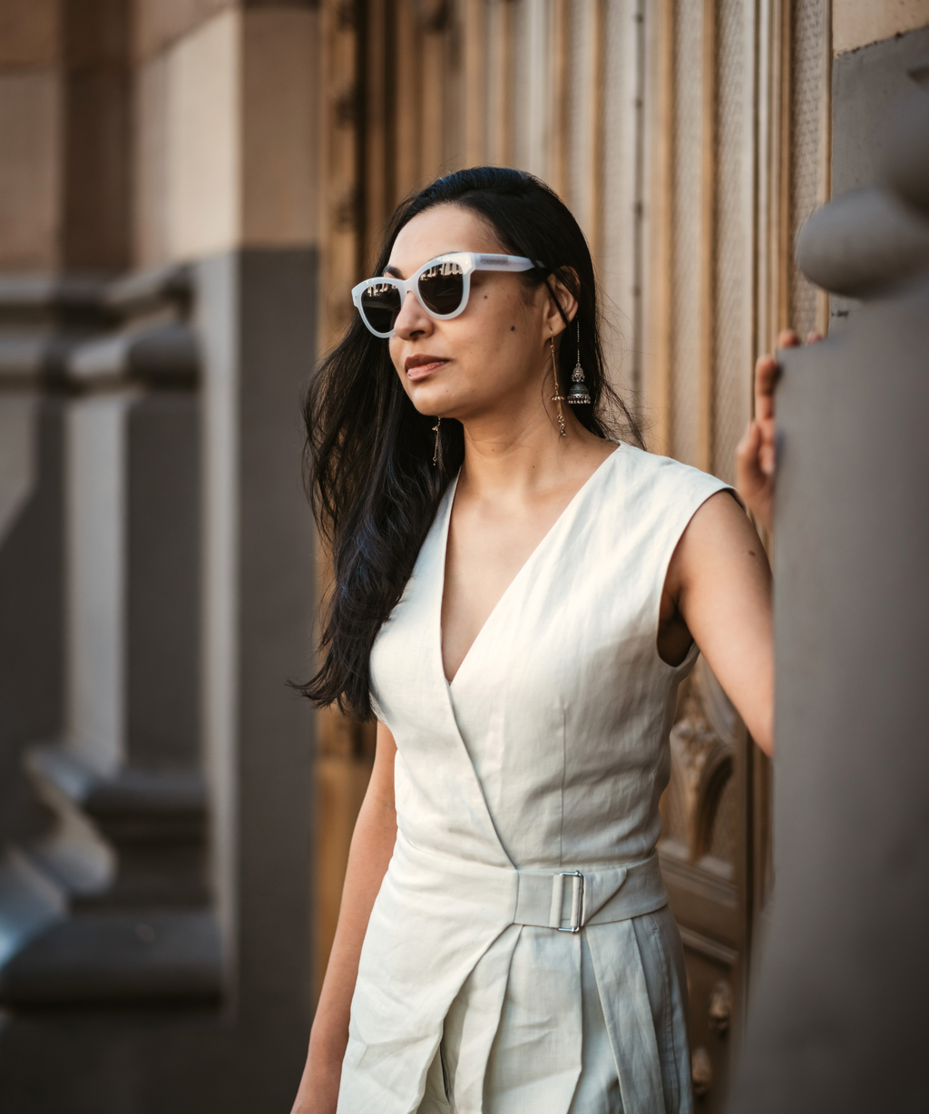 Woman wearing white sunglasses